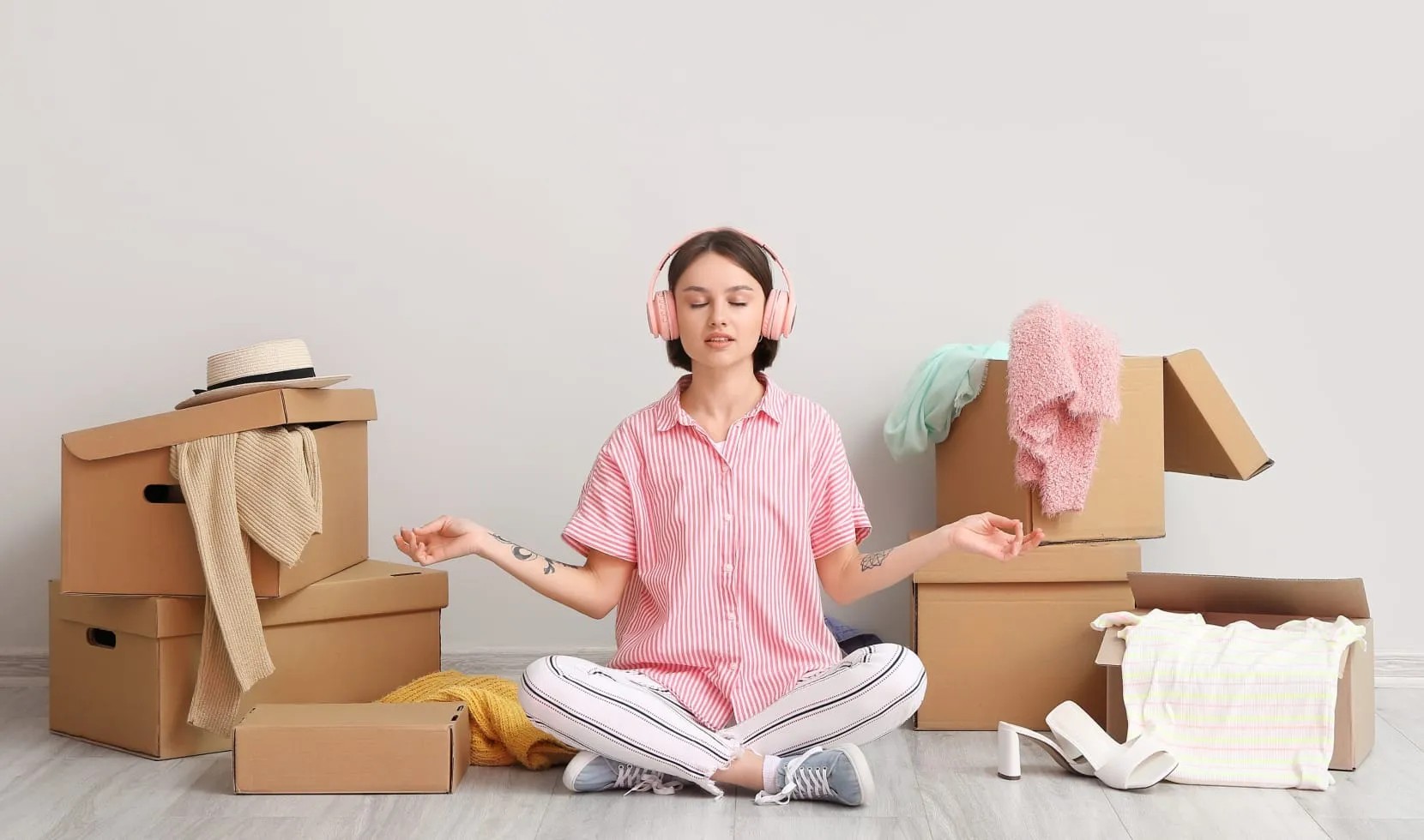 Zen Moving - Meditation During Relocation Woman meditating surrounded by moving boxes